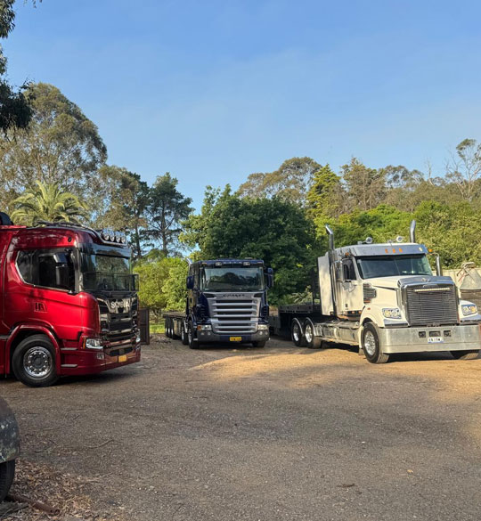 Super Tilt Tray Hire Sydney truck transporting heavy machinery across NSW